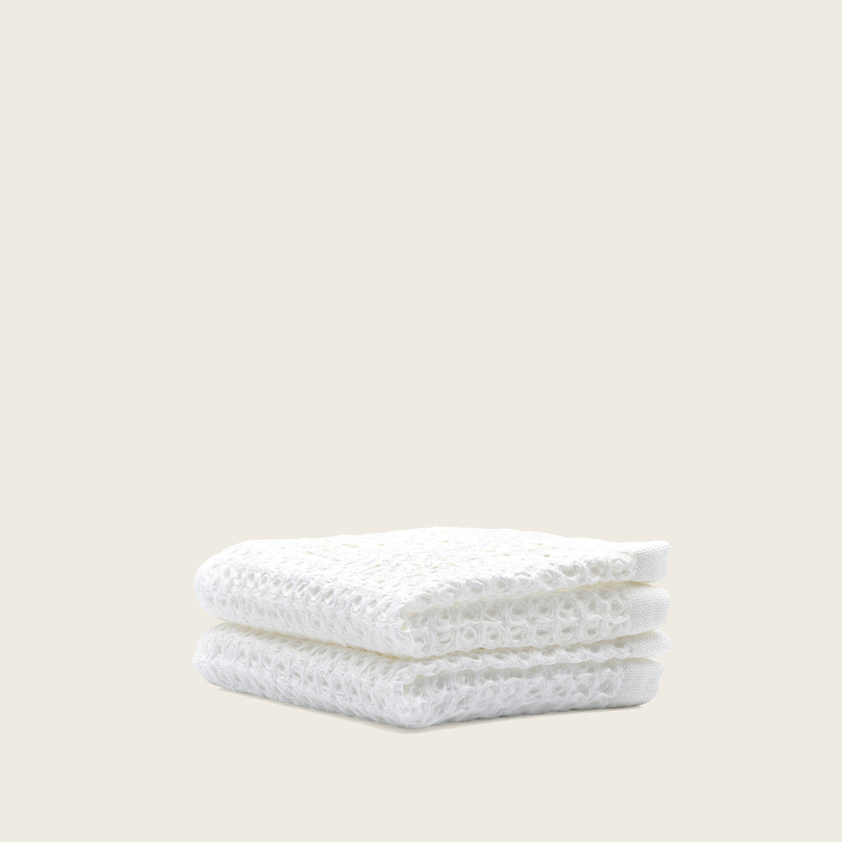 Set of two white Sedona waffle bath towels by Italic, showing soft, textured fabric ideal for home bathroom use.