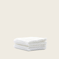 Set of two white Sedona waffle bath towels by Italic, showing soft, textured fabric ideal for home bathroom use.