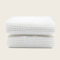 Set of two white Sedona waffle bath towels by Italic, soft, textured home bath towels for everyday use.