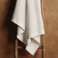 Set of two white Sedona waffle bath towels by Italic, soft and absorbent for home use.