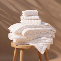 Set of two white Sedona waffle bath towels from Italic, soft and textured home bath towels displayed in the image.