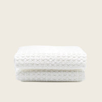 Set of two white Sedona waffle towels from Italic, soft and textured bath washcloths for home use.