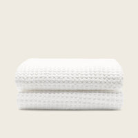 Set of two white Sedona waffle bath towels from Italic, soft and absorbent for home bathroom use.
