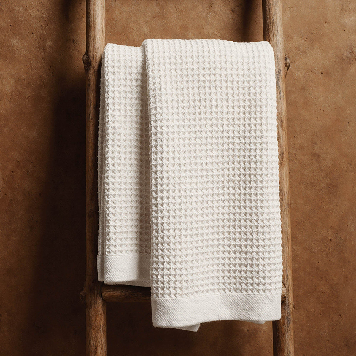 Set of two white Sedona waffle bath towels by Italic, showing soft textured fabric and plush surface for home use.