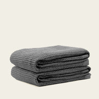 Set of two white Sedona waffle towels from Italic, soft and absorbent bath washcloths for home use.