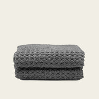 Set of two white Sedona waffle bath towels by Italic, soft and textured for luxurious home bath use.