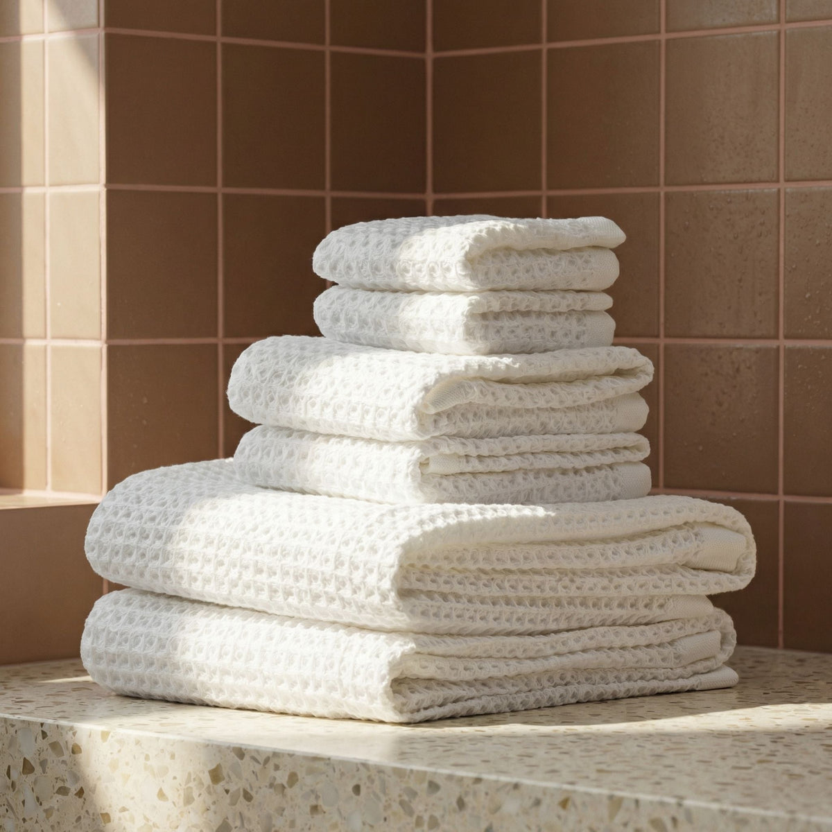 Set of two white Sedona Waffle Towels by Italic, soft and absorbent bath towels with a textured waffle weave design.