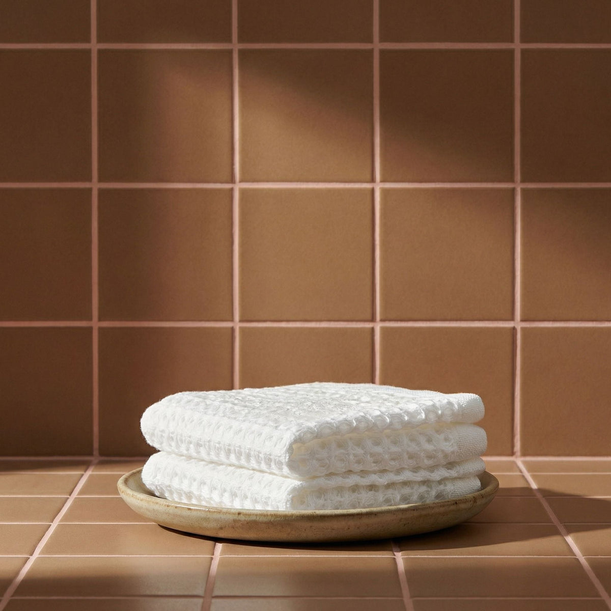 Set of two white Sedona waffle bath towels by Italic, soft and absorbent for home use.