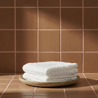 Set of two white Sedona waffle bath towels by Italic, soft and absorbent for home use.