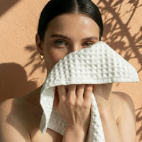 Set of two white Sedona waffle bath towels by Italic, soft and textured for home bath use.