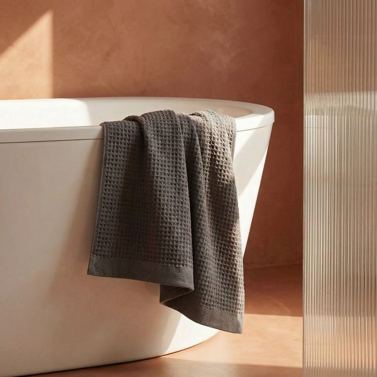 Set of two white Sedona waffle bath towels by Italic, soft and absorbent for home bathroom use.