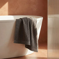 Set of two white Sedona waffle bath towels by Italic, soft and absorbent for home bathroom use.