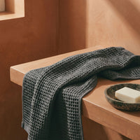 Set of two white Sedona waffle bath towels by Italic, soft and textured for home bathroom use.