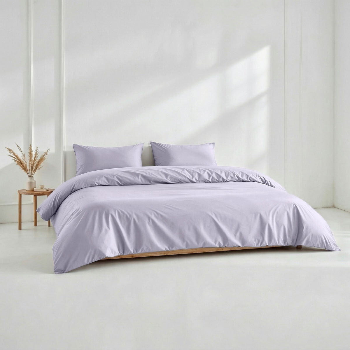 Blue and white Luxe Australian Sateen Bedding Bundle by Italic on a bed, showcasing smooth, luxurious sateen fabric and elegant design.