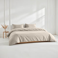 Blue and white Luxe Australian Sateen Bedding Bundle by Italic on a bed, featuring smooth, luxurious sateen sheets and pillowcases.