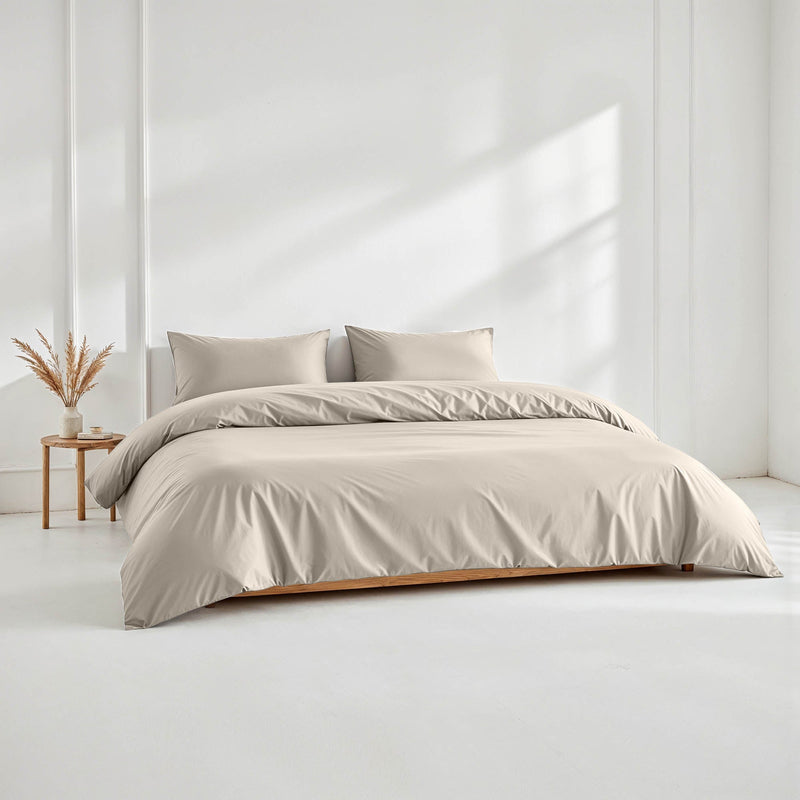 Blue and white Luxe Australian Sateen Bedding Bundle by Italic on a bed, featuring smooth, luxurious sateen sheets and pillowcases.