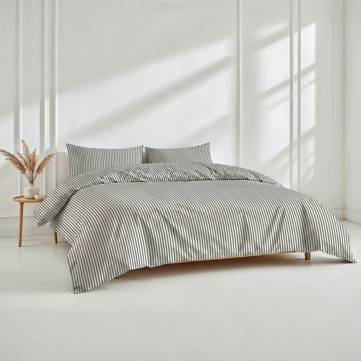 Blue and white Luxe Australian Sateen Bedding Bundle from Italic, twin-sized bed with smooth, luxurious sateen sheets and pillowcases.