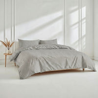 Blue and white Luxe Australian Sateen Bedding Bundle from Italic, twin-sized bed with smooth, luxurious sateen sheets and pillowcases.