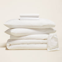 Blue and white Luxe Australian Sateen Bedding Bundle by Italic on a twin bed, featuring smooth, luxurious satin fabric for a stylish bedroom look.