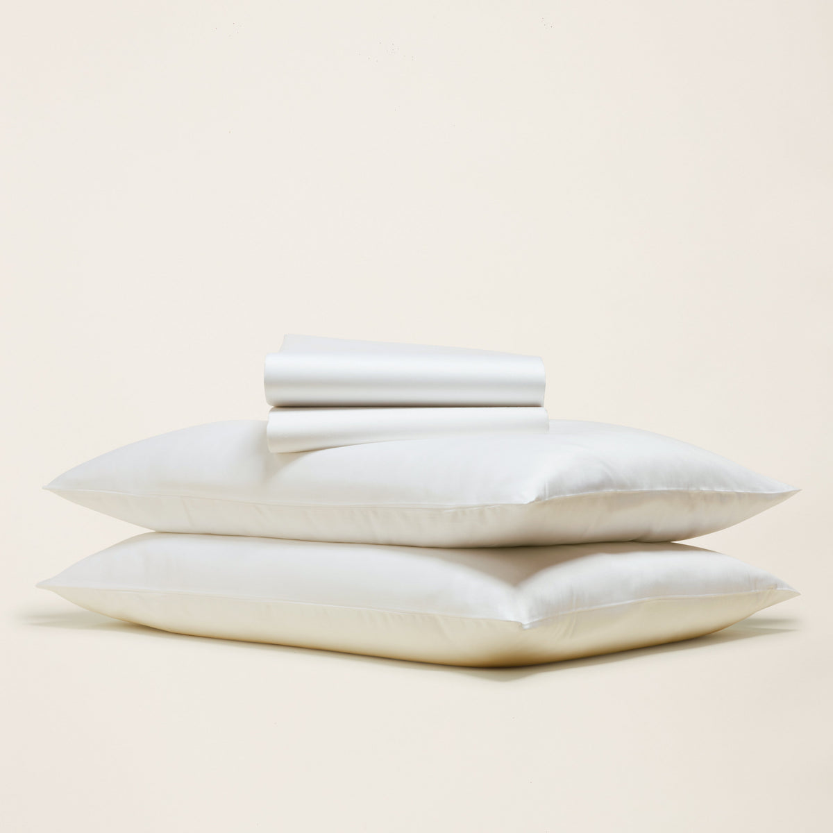 Blue and white Luxe Australian Sateen Bedding Bundle by Italic, featuring a cozy twin bed with smooth satin sheets and pillowcases.