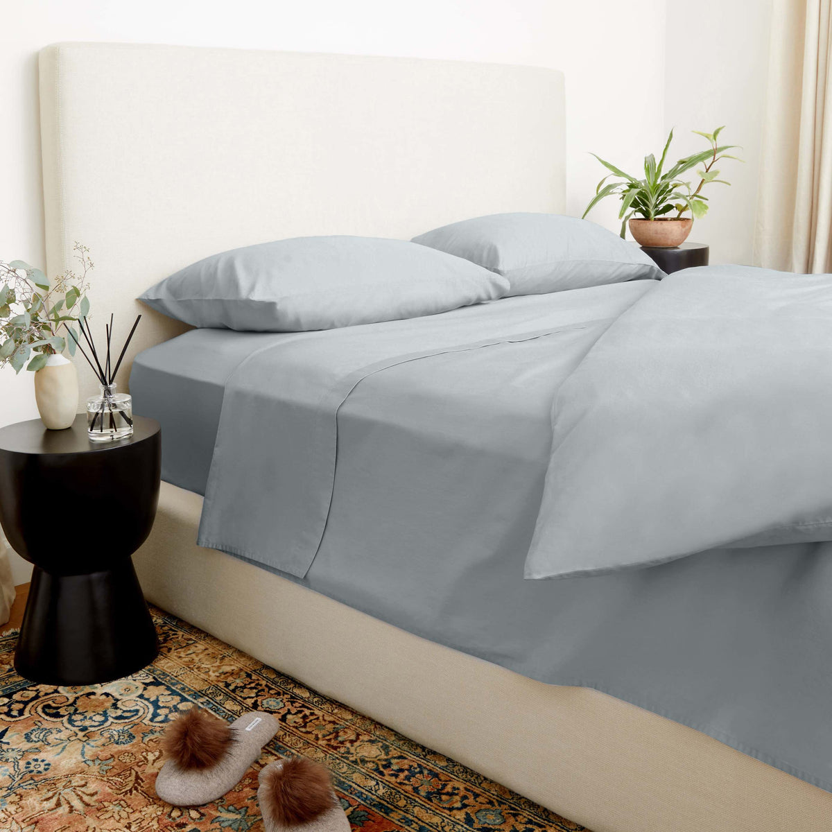 Blue and white Luxe Australian Sateen Bedding Bundle by Italic, twin-sized bed with smooth, luxurious satin finish.