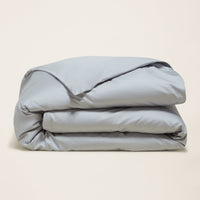 Blue and white Luxe Australian Sateen Bedding Bundle by Italic, featuring soft, luxurious twin bed sheets and pillowcases.