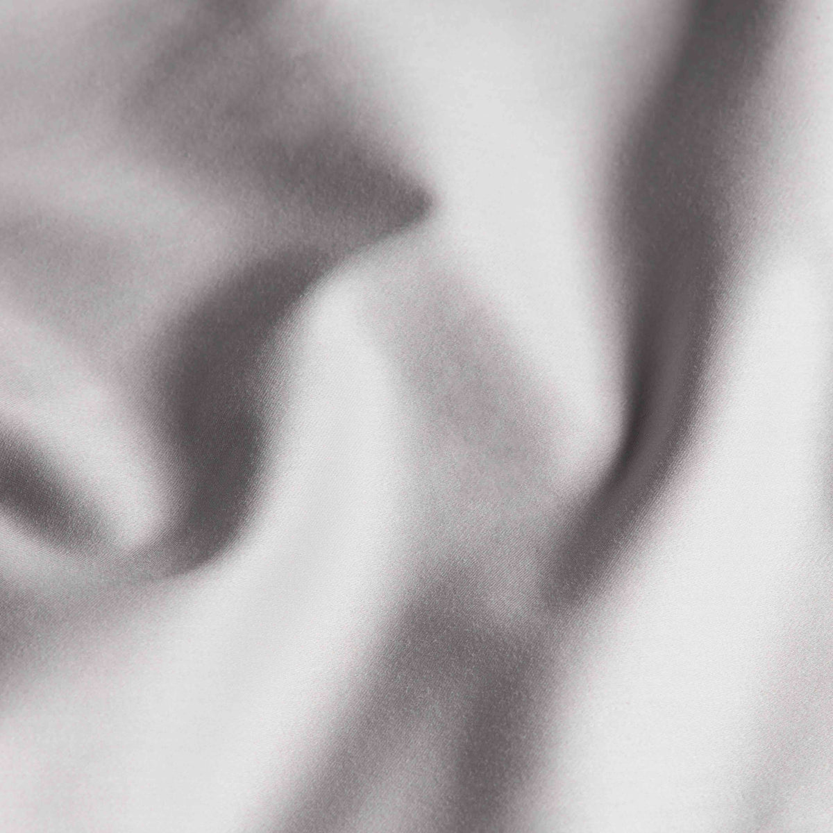 Blue and white Luxe Australian Sateen Bedding Bundle by Italic on a bed, showcasing soft, luxurious sateen fabric in a cozy home setting.