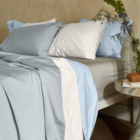 Blue and white Luxe Australian Sateen Bedding Bundle by Italic, twin-sized bed with smooth, luxurious sateen fabric for a stylish bedroom.