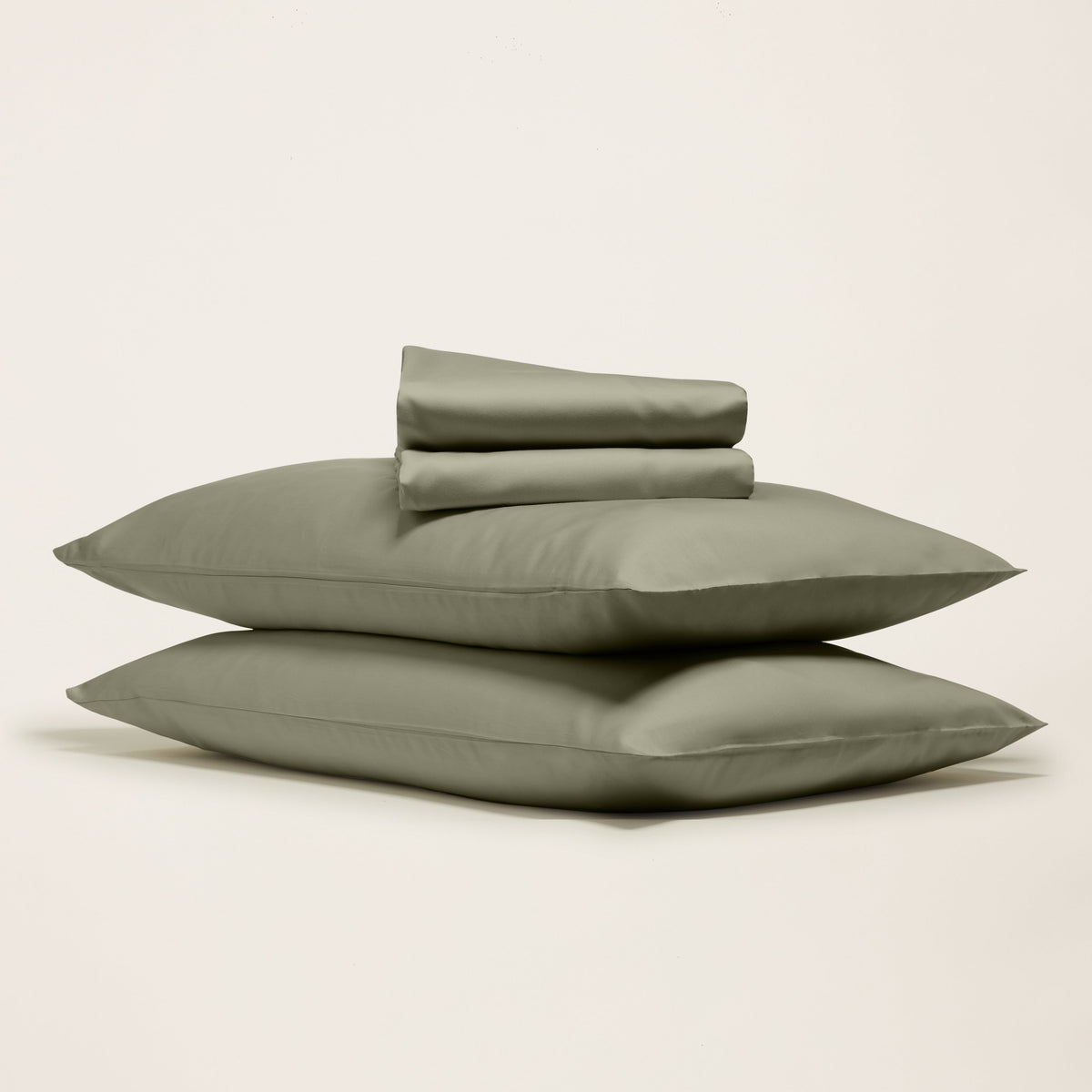 Blue and white Luxe Australian Sateen Bedding Bundle from Italic on a bed with matching pillows and luxurious fabric.