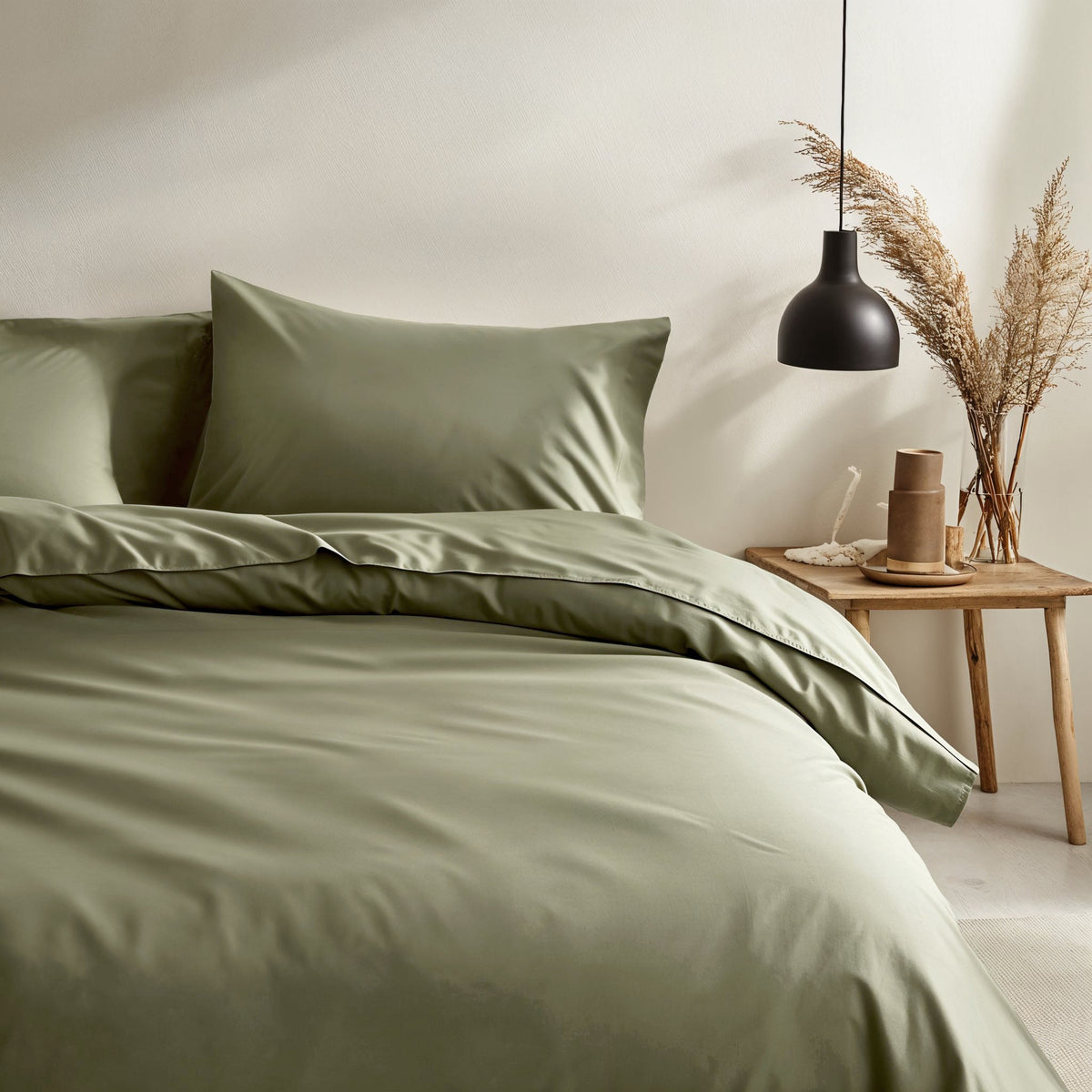 Blue and white Luxe Australian Sateen bedding bundle by Italic, featuring a neatly made twin bed with smooth, luxurious sheets.