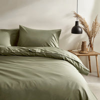 Blue and white Luxe Australian Sateen bedding bundle by Italic, featuring a neatly made twin bed with smooth, luxurious sheets.