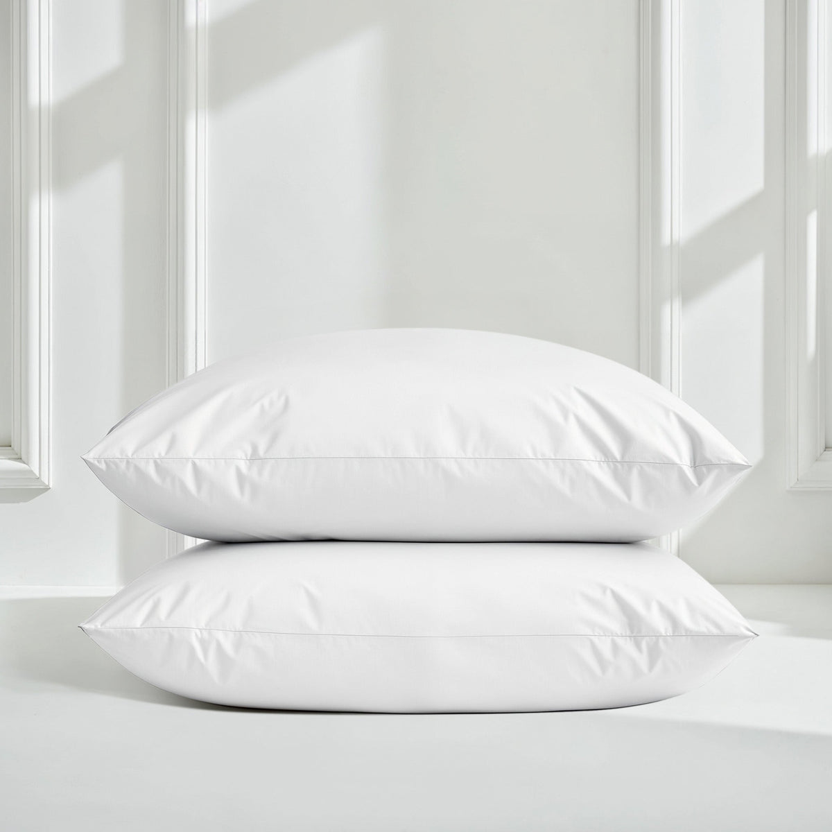 Blue and white Luxe Australian Sateen Bedding Bundle by Italic on a bed with smooth, luxurious sateen fabric.