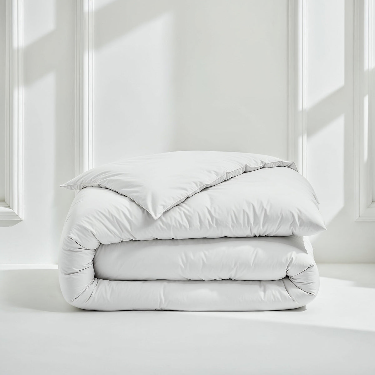 Blue and white Luxe Australian Sateen Bedding Bundle from Italic on a bed, showcasing smooth, luxurious satin fabric and twin size bedding.