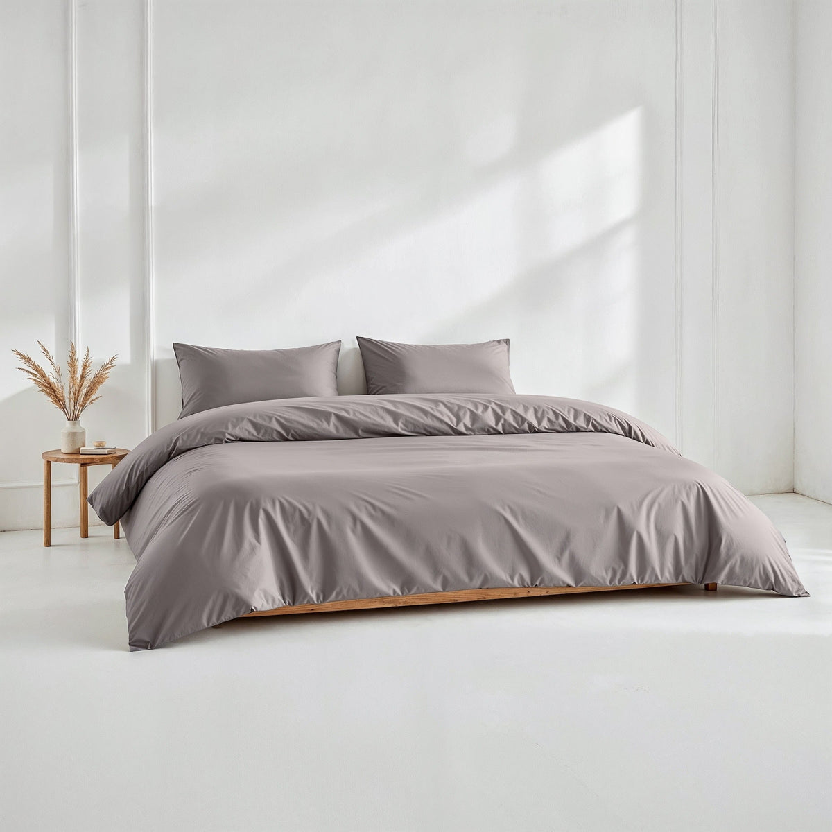 Blue and white Australian sateen bedding bundle by Italic, featuring a soft, luxurious twin bed set with pillows and duvet cover.