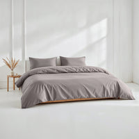 Blue and white Australian sateen bedding bundle by Italic, featuring a soft, luxurious twin bed set with pillows and duvet cover.