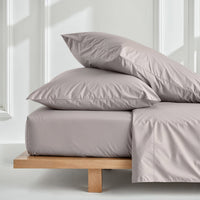 Blue and white Luxe Australian Sateen Bedding Bundle by Italic on a bed, showcasing smooth, luxurious satin fabric in a home bedroom setting.