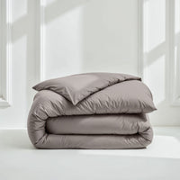 Blue and white Luxe Australian Sateen Bedding Bundle from Italic, twin size with soft, luxurious sateen fabric for a cozy home bed.