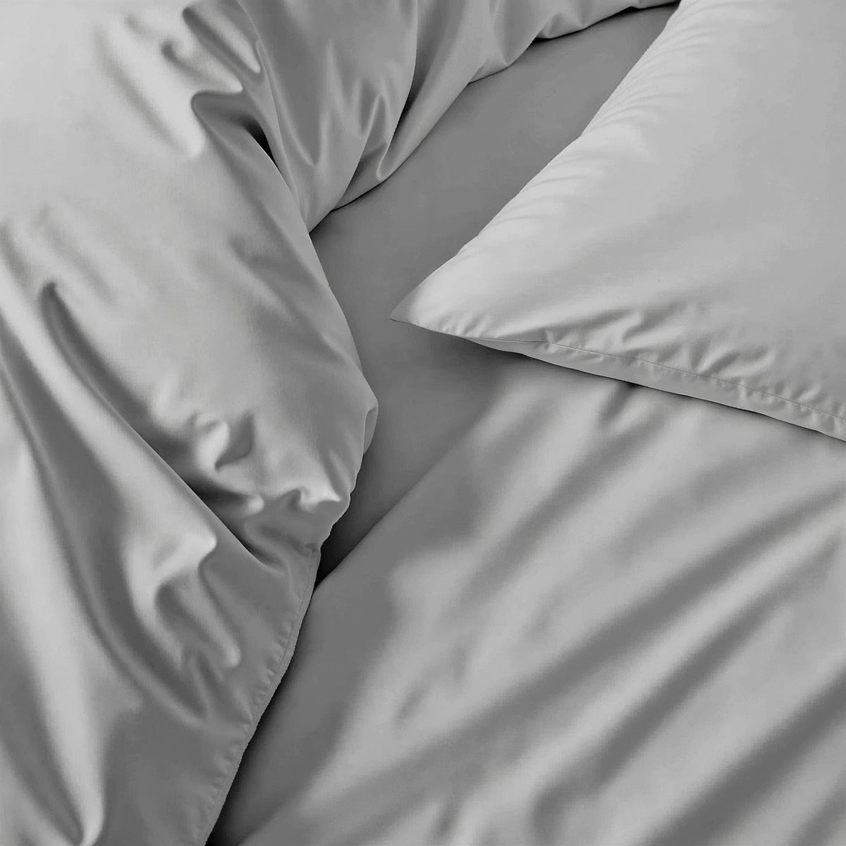 Blue and white Luxe Australian Sateen Bedding Bundle by Italic on a bed, showcasing smooth, luxurious sateen fabric for a cozy home bedroom.