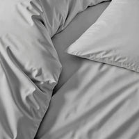 Blue and white Luxe Australian Sateen Bedding Bundle by Italic on a bed, showcasing smooth, luxurious sateen fabric for a cozy home bedroom.