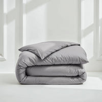 Blue and white Luxe Australian Sateen Bedding Bundle by Italic, twin size, featuring smooth, luxurious bed sheets and pillowcases.