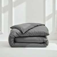 Blue and white Luxe Australian Sateen Bedding Bundle from Italic on a bed, featuring smooth, luxurious sateen sheets and pillowcases.