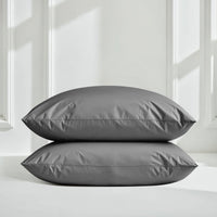 Italic Luxe Australian Sateen Bedding Bundle on twin bed featuring soft blue and white sateen sheets and pillowcases.