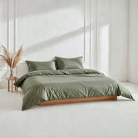 Blue and white Luxe Australian Sateen Bedding Bundle by Italic, featuring a cozy twin bed with smooth, luxurious fabric.