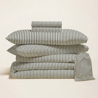 Blue and white Luxe Australian Sateen Bedding Bundle by Italic, featuring soft, luxurious twin bed sheets and pillowcases.