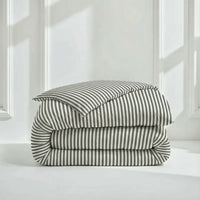 Blue and white Luxe Australian Sateen Bedding Bundle by Italic on a twin bed, featuring smooth, luxurious fabric and elegant design.