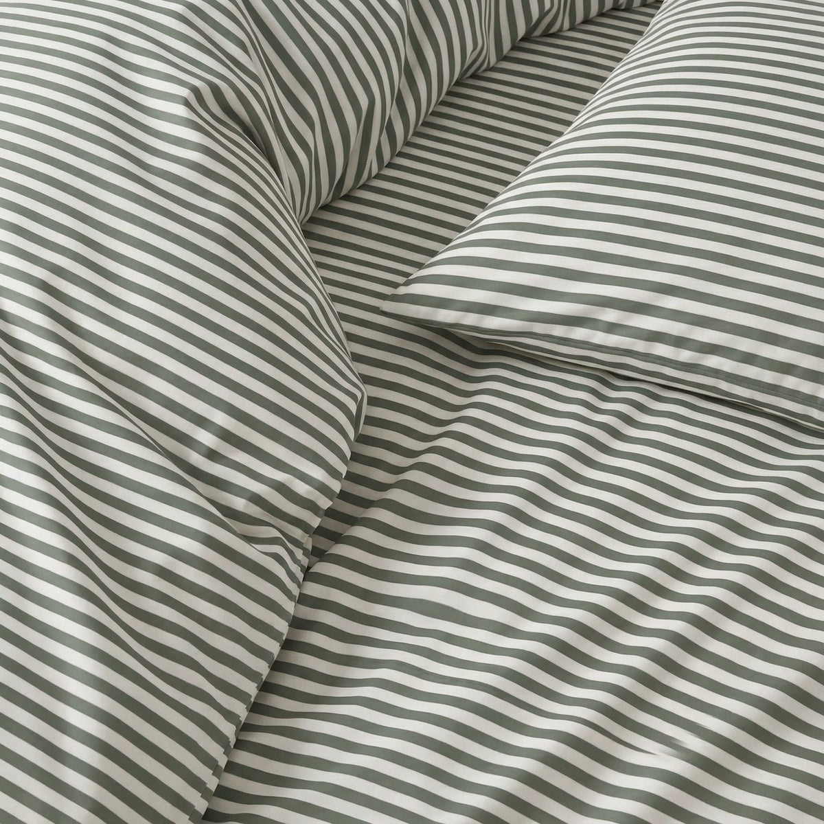 Blue and white Luxe Australian Sateen Bedding Bundle from Italic, twin size with soft, luxurious sateen fabric for a cozy bed.