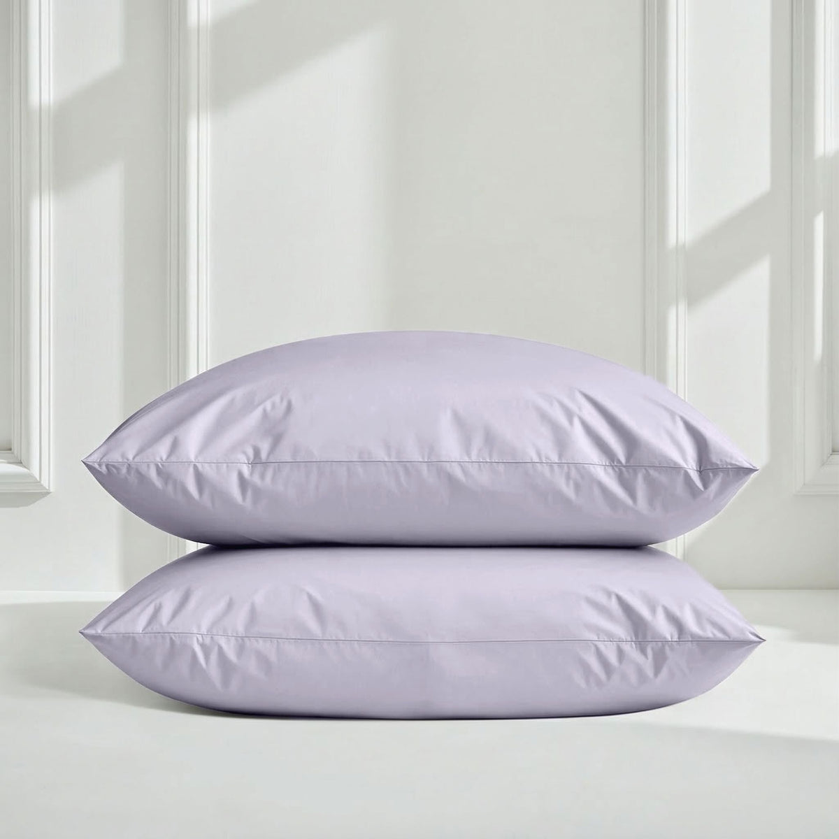 Blue and white Luxe Australian Sateen Bedding Bundle by Italic on a bed, showcasing smooth, luxurious sateen fabric and twin size bedding.