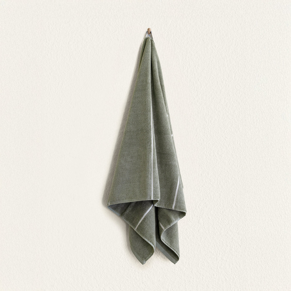 Set of two Italic Deia Towels in sage and ecru, soft home bed washcloths with plush, absorbent fabric for comfortable use.