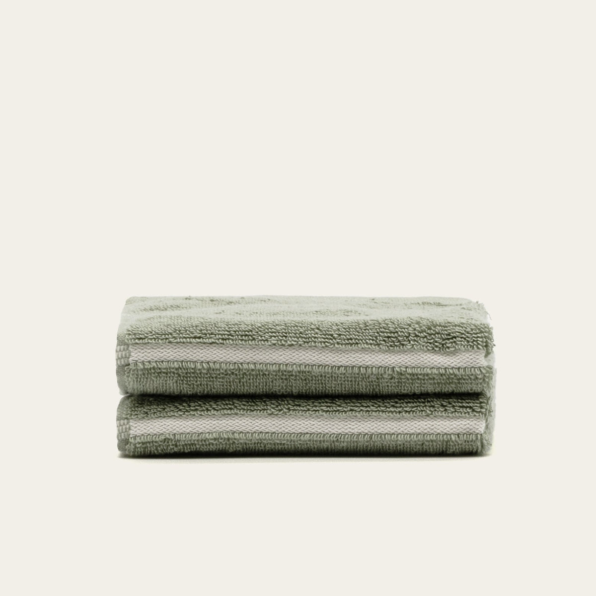 Set of two Italic Deia Sage and Ecru bed towels, soft home linens for a cozy bedroom decor.