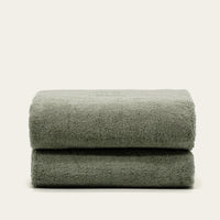 Set of two Italic Deia home bed towels in sage and ecru, soft washcloths for bathroom or bed linens.